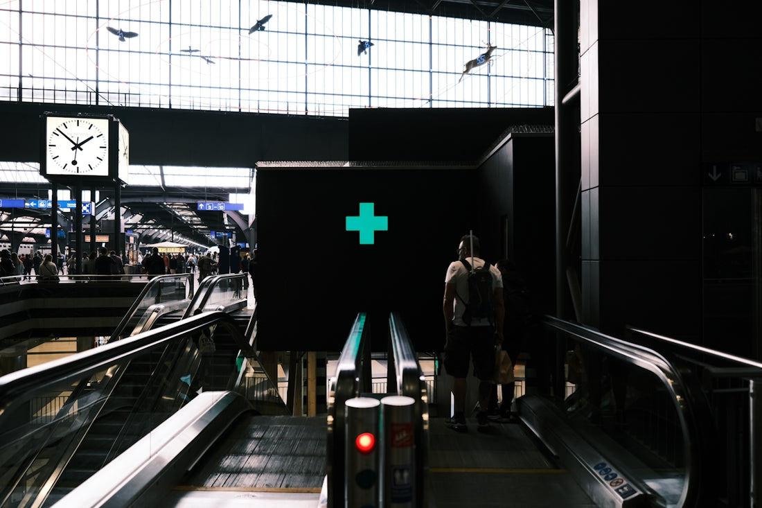 a person stands in a train station