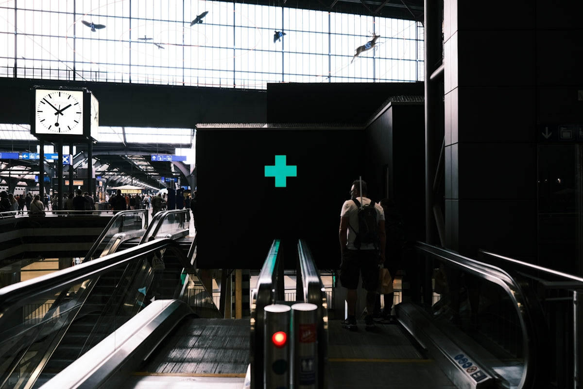 a person stands in a train station