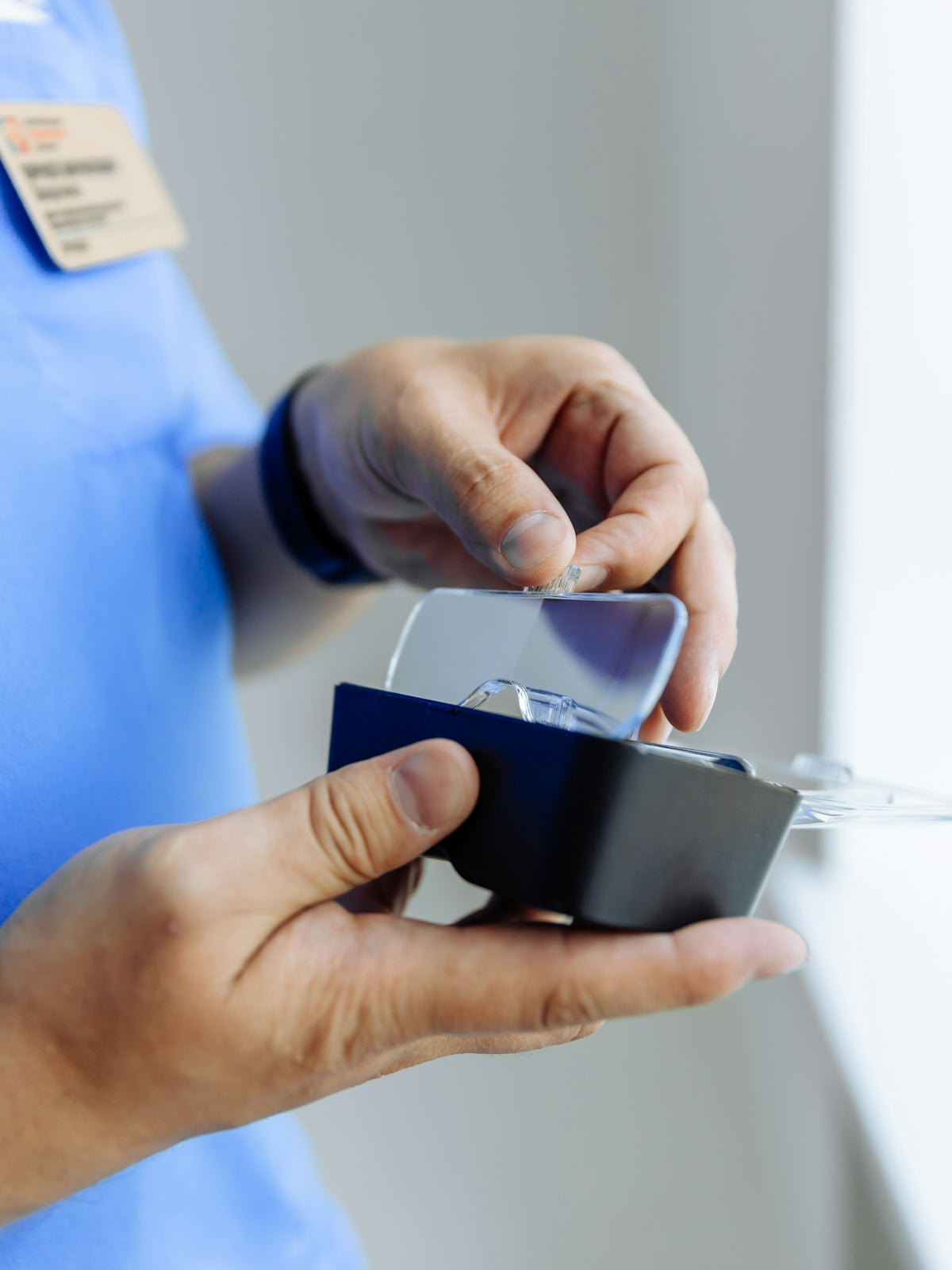 a person holding a cell phone in their hand